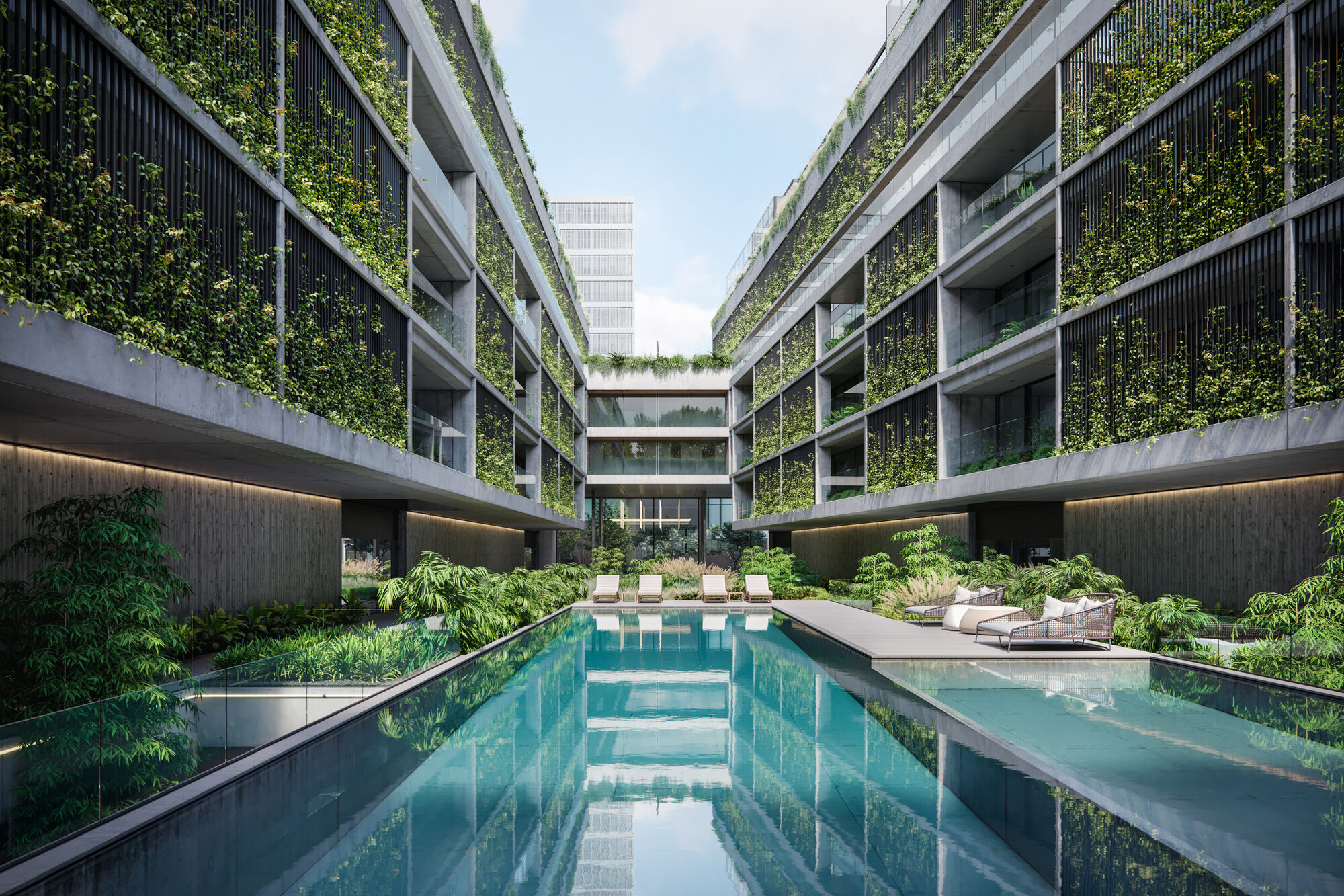 Piscina central del edificio entre las dos alas con fachadas verdes