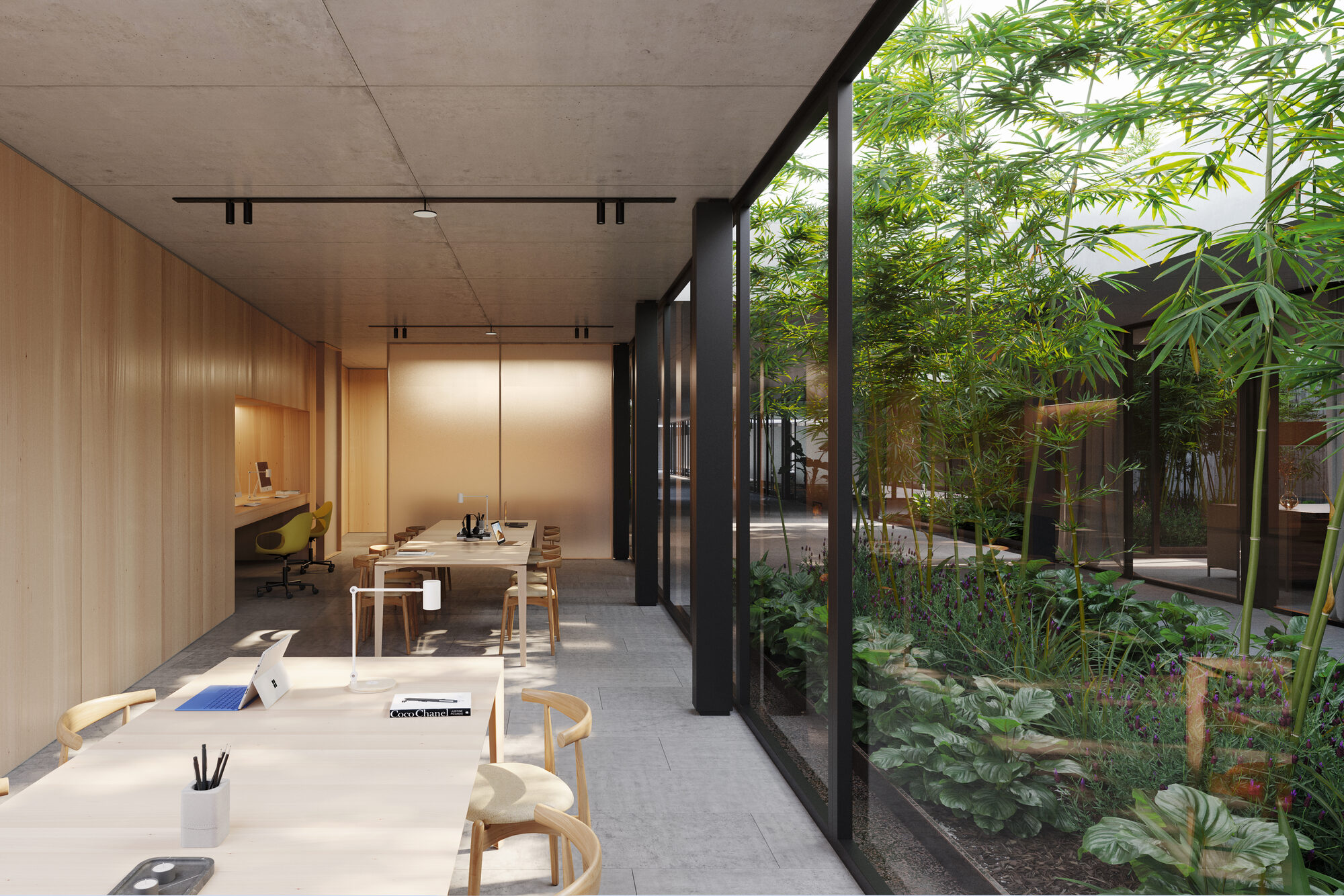 Espacio de coworking con vista al patio de bambúes